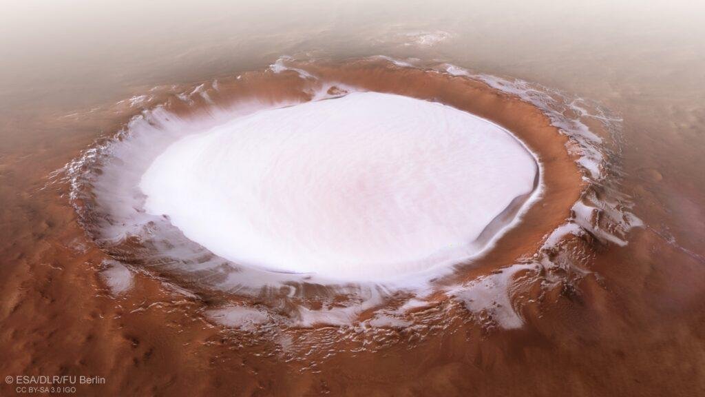 Korolev crater, an 82-kilometre-across feature found in the northern lowlands of Mars. Top 5 Best Travel Spots in the solar system to visit
