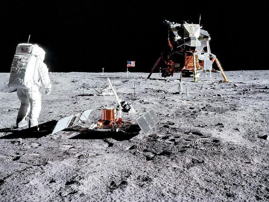 Apollo 11 - Tranquility Base. Astronaut Edwin "Buzz" Aldrin deploying two experiment packages during the Apollo 11 EVA. Top 5 Best Travel Spots in the solar system to visit